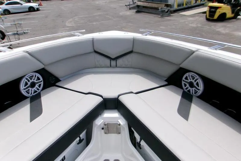  Yacht Photos Pics 2026 Monterey Elite 30 OB boat interior with cushioned seating and speakers.