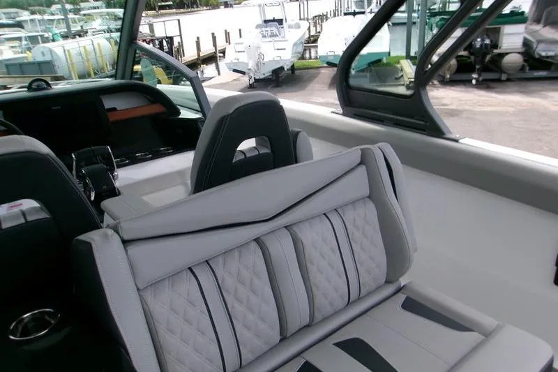  Yacht Photos Pics 2026 Monterey Elite 30 OB boat interior with luxurious seating and modern design.