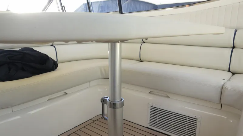 1299 Yacht Photos Pics Luxurious interior seating of 1996 Sunseeker Predator 63 yacht with elegant white upholstery.