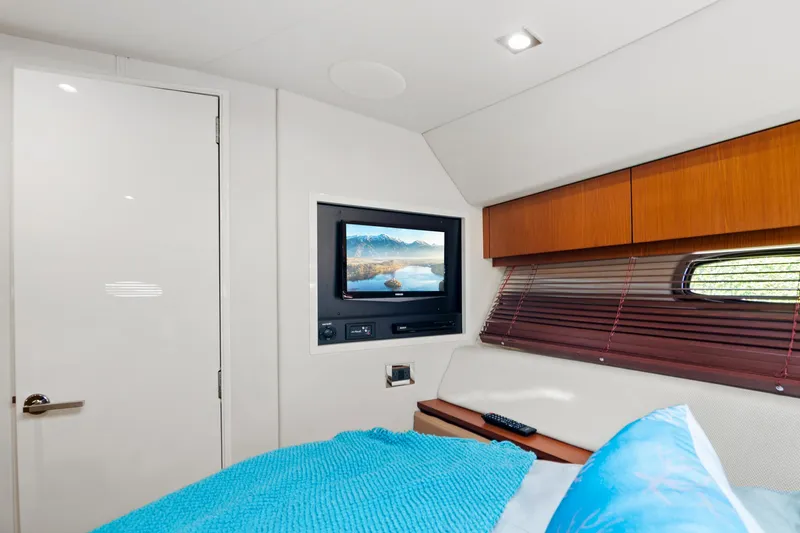  Yacht Photos Pics Interior cabin of 2013 Sea Ray 410 Sundancer with TV and cozy bedding.