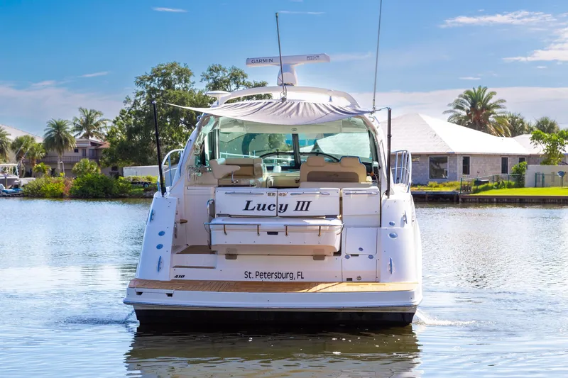  Yacht Photos Pics Sea Ray 410 Sundancer 2013 yacht on water, rear view, sunny day, St. Petersburg, FL.