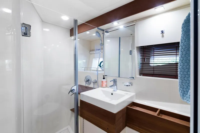  Yacht Photos Pics Luxurious bathroom in 2013 Sea Ray 410 Sundancer yacht with modern fixtures and elegant design.