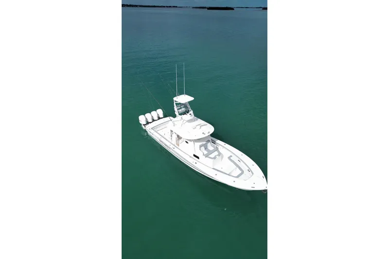  Yacht Photos Pics 2018 Regulator 41 boat on calm turquoise water, aerial view.