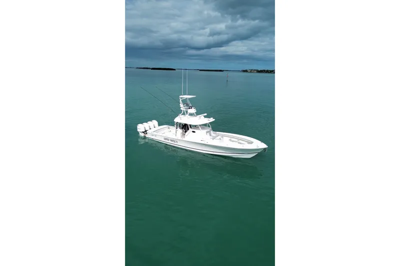 Yacht Photos Pics 2018 Regulator 41 boat on calm water under cloudy sky.