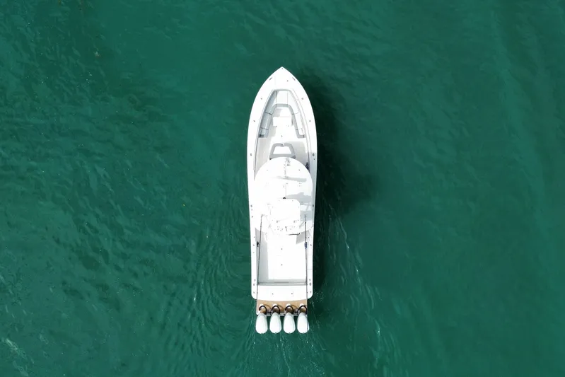  Yacht Photos Pics Aerial view of 2018 Regulator 41 boat on clear turquoise water.