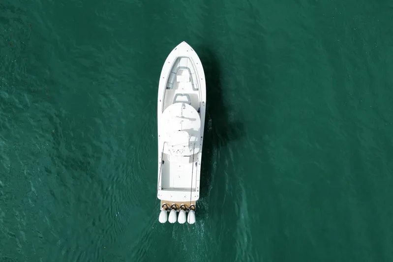  Yacht Photos Pics Aerial view of 2018 Regulator 41 boat on turquoise water.