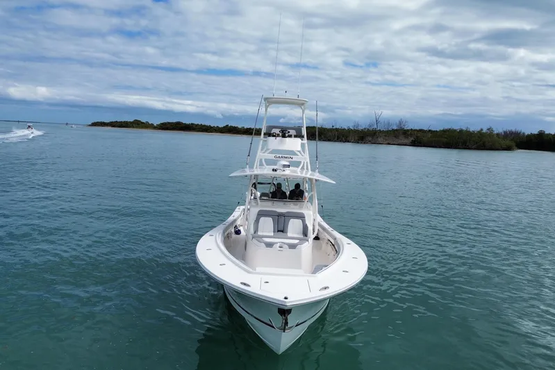  Yacht Photos Pics 2018 Regulator 41 boat on calm water under cloudy sky.