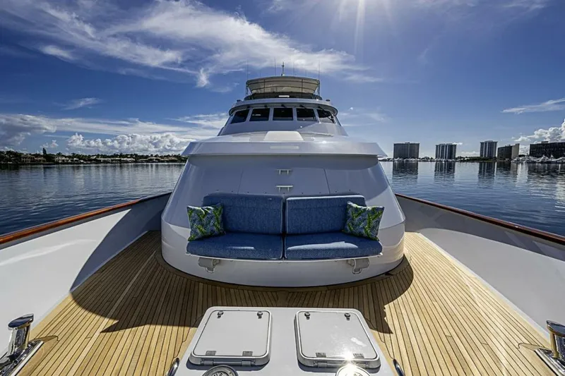 Probability Yacht Photos Pics Luxurious 1997 Delta 122 Tri-Deck Motor Yacht on calm waters, featuring elegant deck seating.