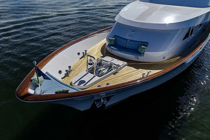 Probability Yacht Photos Pics Luxurious 1997 Delta 122 Tri-Deck Motor Yacht with elegant deck and seating area.