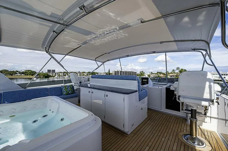 Probability Yacht Photos Pics Luxurious 1997 Delta 122 Tri-Deck Motor Yacht with jacuzzi and seating area on deck.