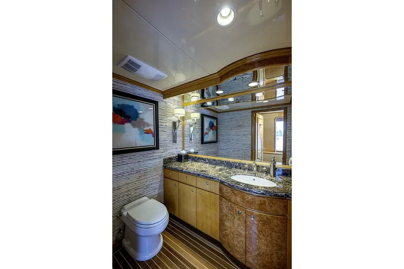 Probability Yacht Photos Pics Luxurious bathroom on 1997 Delta 122 Tri-Deck Motor Yacht with elegant wood and marble finishes.