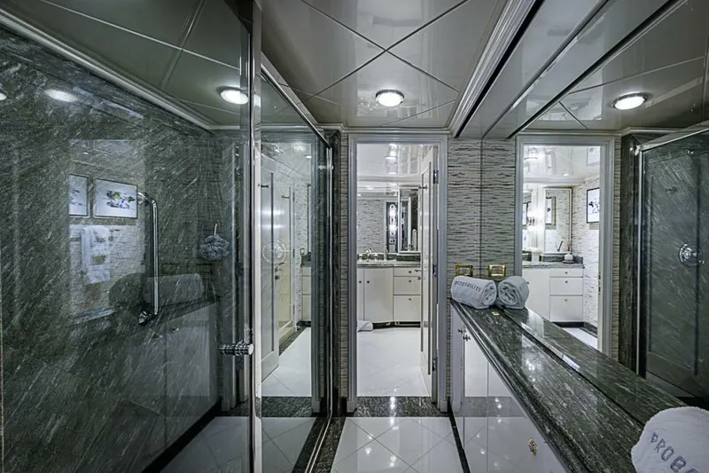 Probability Yacht Photos Pics Luxurious bathroom on 1997 Delta 122 Tri-Deck Motor Yacht with marble finishes and elegant design.