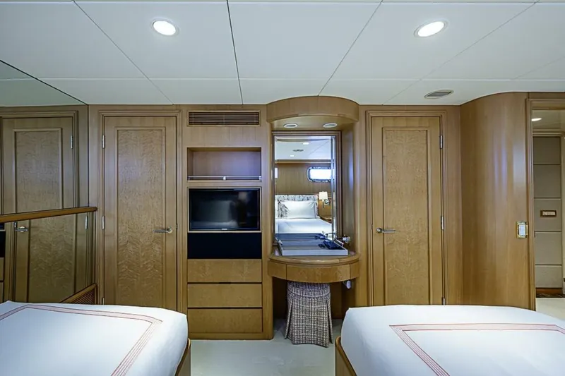 Probability Yacht Photos Pics Luxurious cabin interior of 1997 Delta 122 Tri-Deck Motor Yacht with wood paneling.
