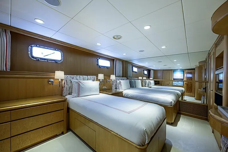Probability Yacht Photos Pics Luxurious bedroom on 1997 Delta 122 Tri-Deck Motor Yacht with elegant wood finishes.