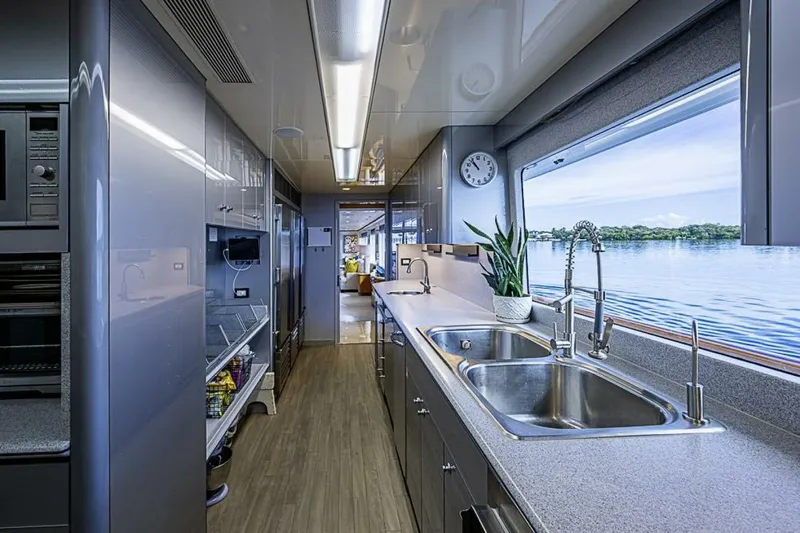 Probability Yacht Photos Pics Luxurious kitchen interior of 1997 Delta 122 Tri-Deck Motor Yacht with ocean view.