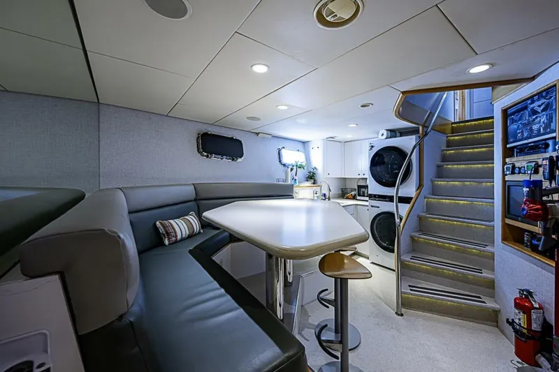 Probability Yacht Photos Pics Luxurious interior of 1997 Delta 122 Tri-Deck Motor Yacht with modern amenities and seating area.