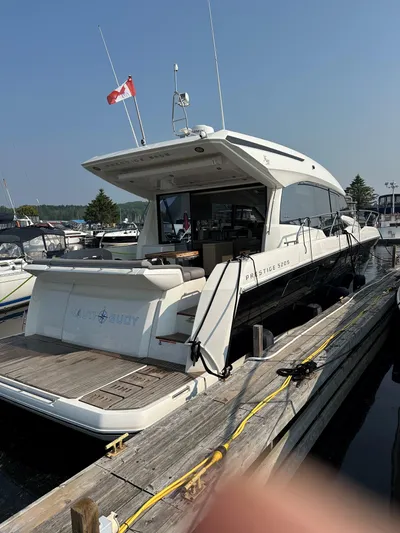  Yacht Photos Pics 2023 Prestige 520S yacht docked at marina with Canadian flag.