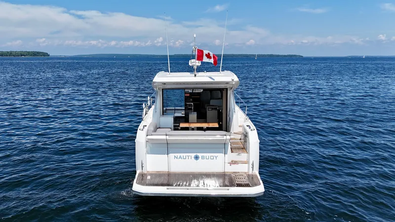  Yacht Photos Pics 2023 Prestige 520S yacht on open water with Canadian flag.