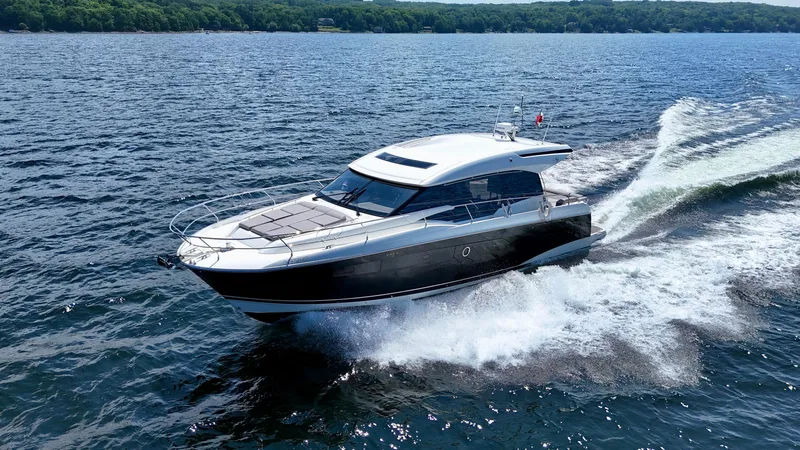  Yacht Photos Pics 2023 Prestige 520S yacht cruising on open water, showcasing sleek design and performance.