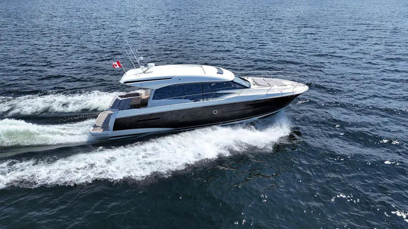  Yacht Photos Pics 2023 Prestige 520S yacht cruising on open water, displaying sleek design and luxury features.