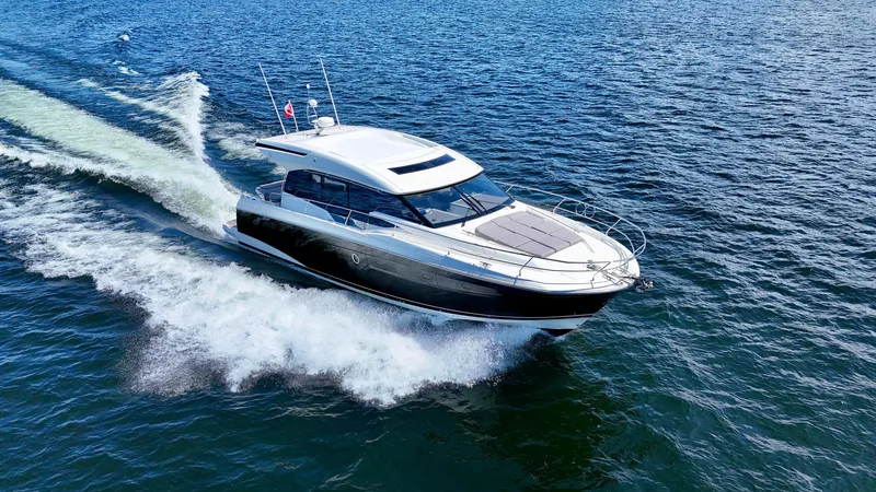  Yacht Photos Pics Luxury 2023 Prestige 520S yacht cruising on open water.
