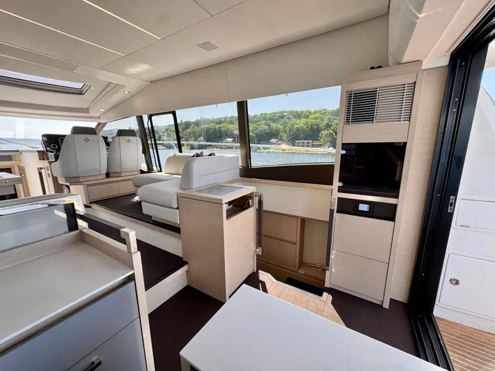  Yacht Photos Pics Luxurious interior of 2023 Prestige 520S yacht with modern seating and panoramic windows.