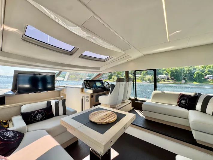  Yacht Photos Pics Luxurious interior of 2023 Prestige 520S yacht with modern seating and panoramic windows.
