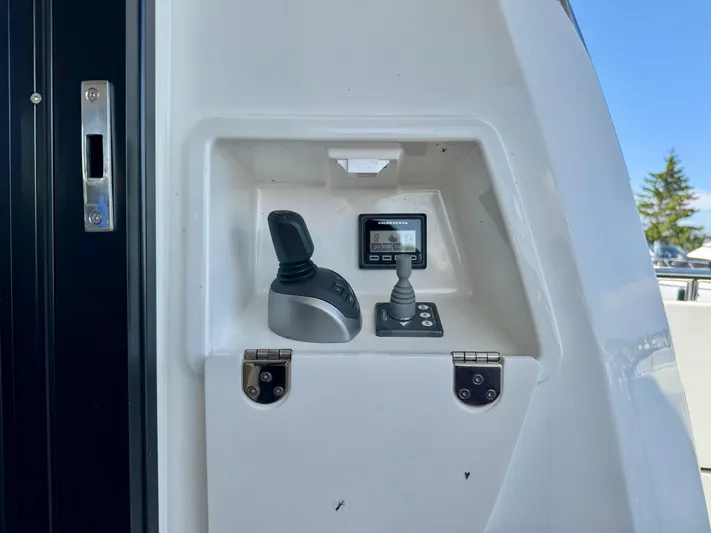  Yacht Photos Pics Control panel of 2023 Prestige 520S yacht with joystick and display.