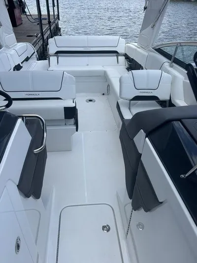  Yacht Photos Pics 2025 Formula 290 Bowrider with sleek white seating and spacious deck layout.