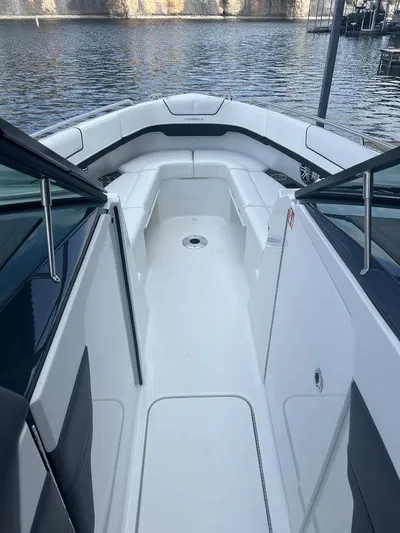  Yacht Photos Pics 2025 Formula 290 Bowrider boat interior with sleek seating and open deck design.