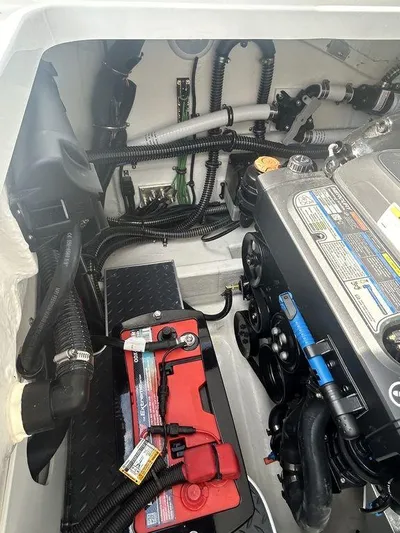  Yacht Photos Pics Engine compartment of 2025 Formula 290 Bowrider boat, showcasing battery and wiring.