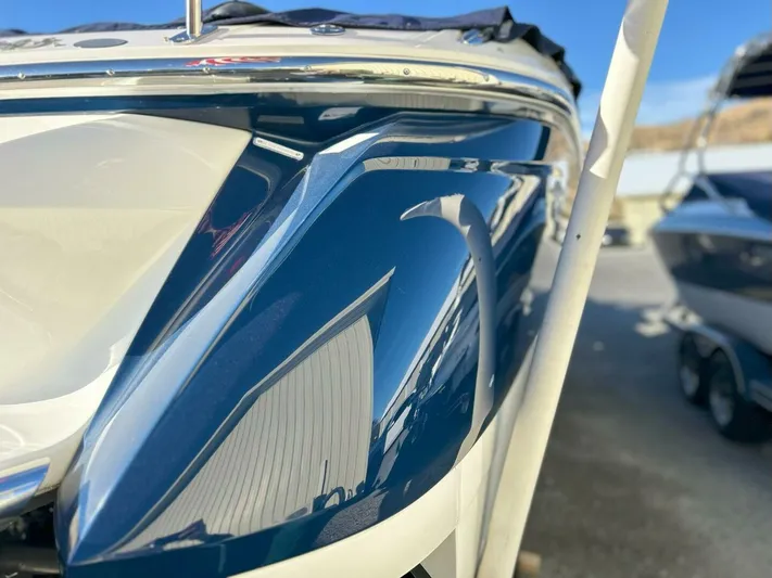 Yacht Photos Pics Close-up of a 2005 Cobalt 343 boat's sleek blue and white hull.