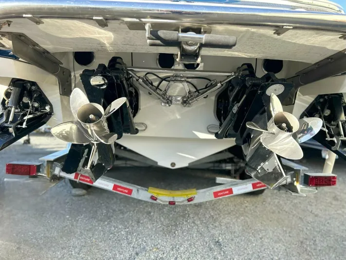  Yacht Photos Pics Rear view of a 2005 Cobalt 343 boat showing dual propellers and trailer.