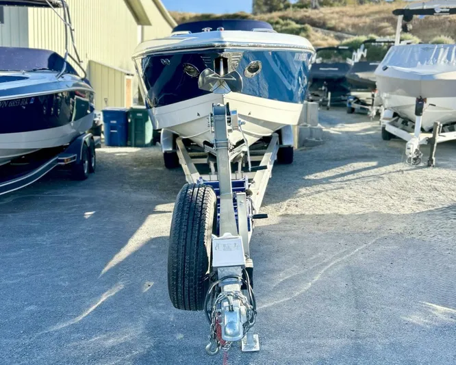 Yacht Photos Pics 2005 Cobalt 343 boat on trailer, parked outdoors in a marina setting.