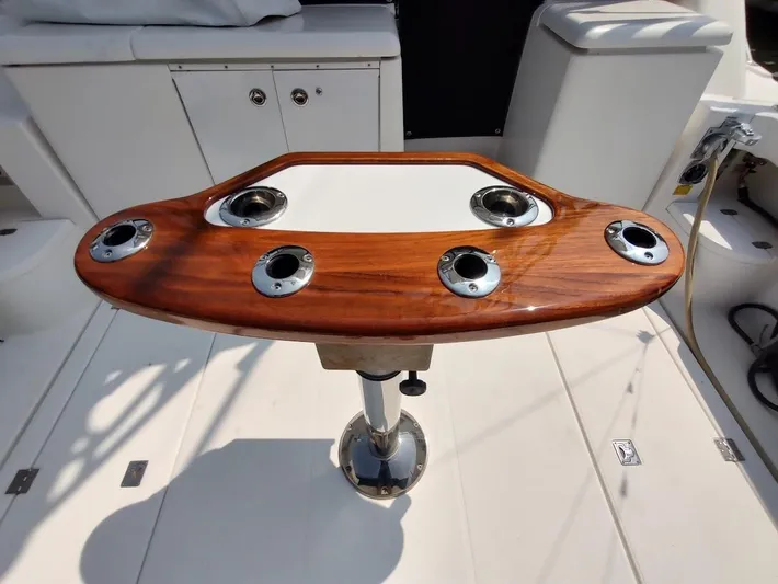 Reel Time Yacht Photos Pics Wooden fishing rod holder on 2005 Rampage 38 Express boat deck.