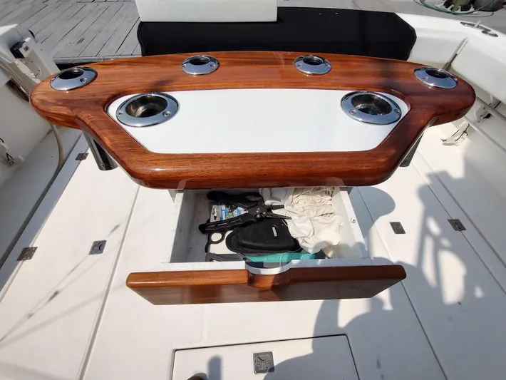 Reel Time Yacht Photos Pics Luxury fishing station on 2005 Rampage 38 Express boat, featuring rod holders and storage.