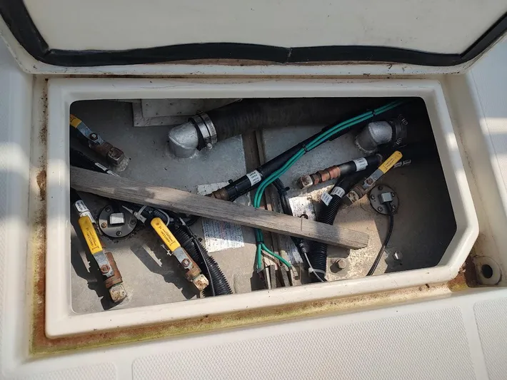 Reel Time Yacht Photos Pics Electrical compartment of a 2005 Rampage 38 Express boat, showing wiring and components.