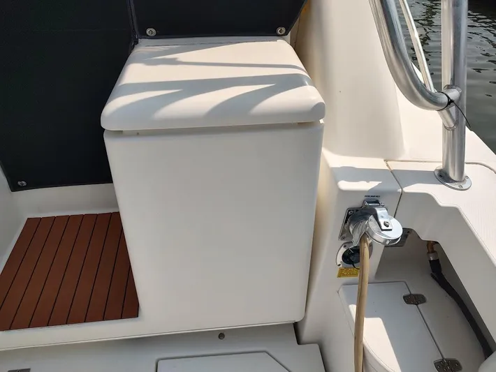 Reel Time Yacht Photos Pics 2005 Rampage 38 Express boat deck with seating and railing.