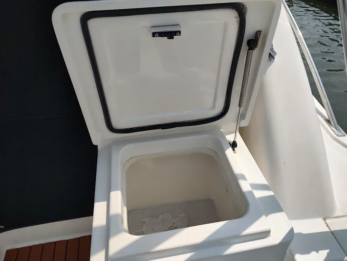 Reel Time Yacht Photos Pics Open storage compartment on 2005 Rampage 38 Express boat, showing interior details.