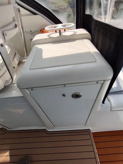 Reel Time Yacht Photos Pics 2005 Rampage 38 Express boat interior with white cabinetry and wooden flooring.