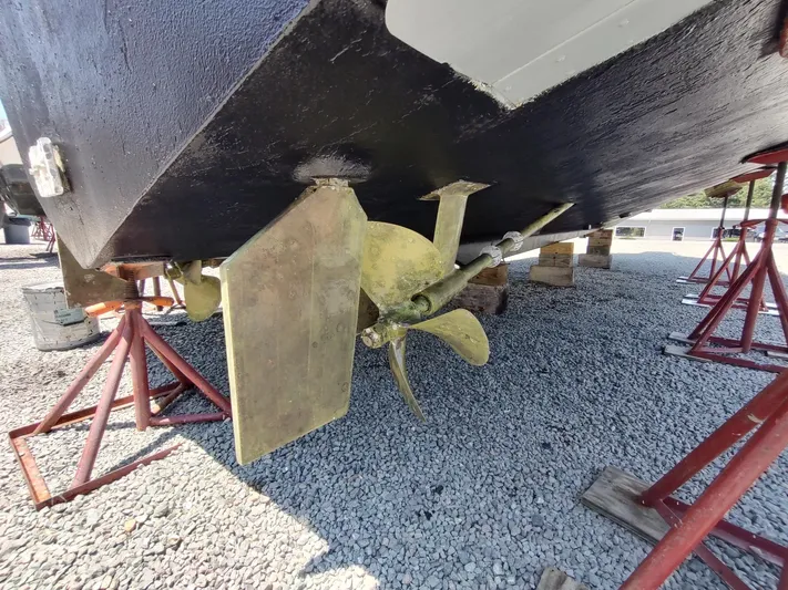 Reel Time Yacht Photos Pics Propeller and rudder of a 2005 Rampage 38 Express boat on stands.