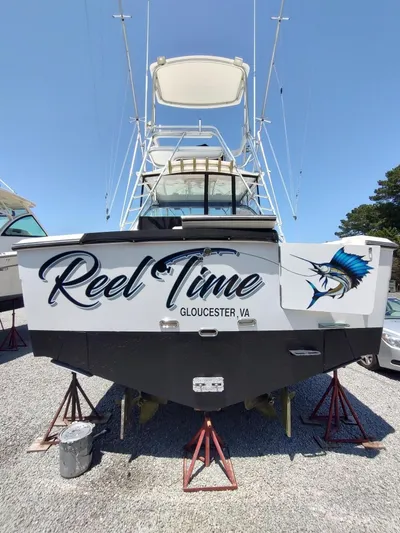 Reel Time Yacht Photos Pics 2005 Rampage 38 Express boat named "Reel Time" in Gloucester, VA, on stands.
