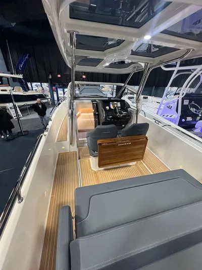  Yacht Photos Pics 2025 Nimbus Tender 8 boat interior with sleek design and modern seating.