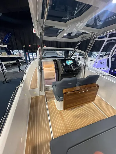  Yacht Photos Pics 2025 Nimbus Tender 8 boat interior with sleek design and modern dashboard.