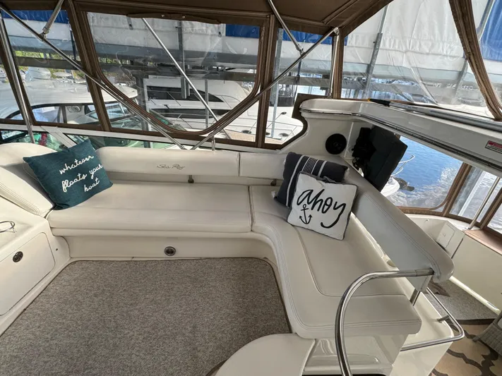 Fathom This Yacht Photos Pics 2001 Sea Ray 420 Aft Cabin interior with cozy seating and nautical-themed pillows.