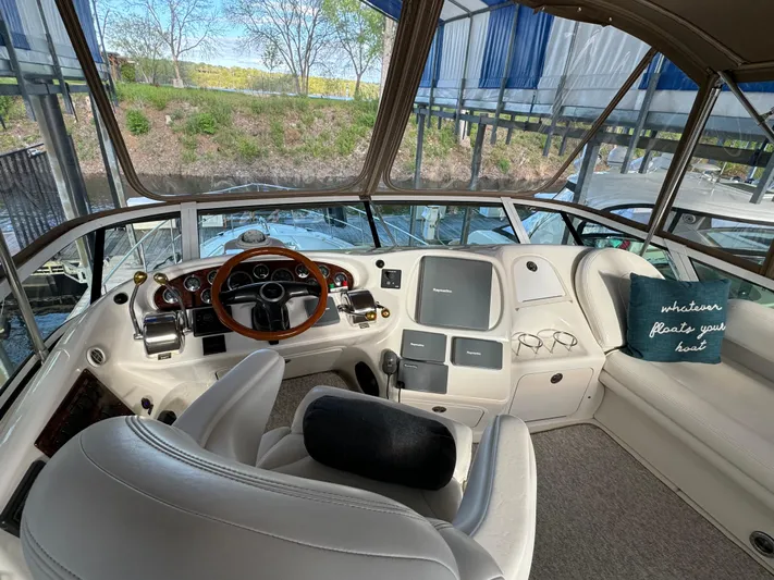 Fathom This Yacht Photos Pics 2001 Sea Ray 420 Aft Cabin helm with plush seating and panoramic windows.