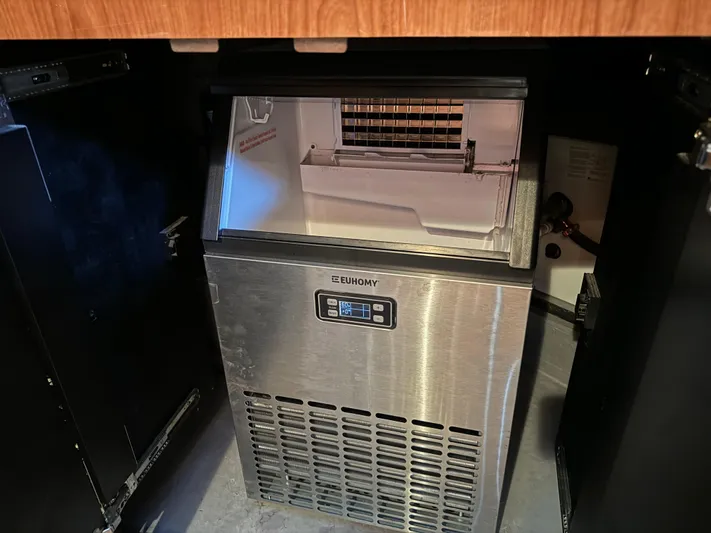 Fathom This Yacht Photos Pics Ice maker inside 2001 Sea Ray 420 Aft Cabin yacht, featuring a stainless steel design.