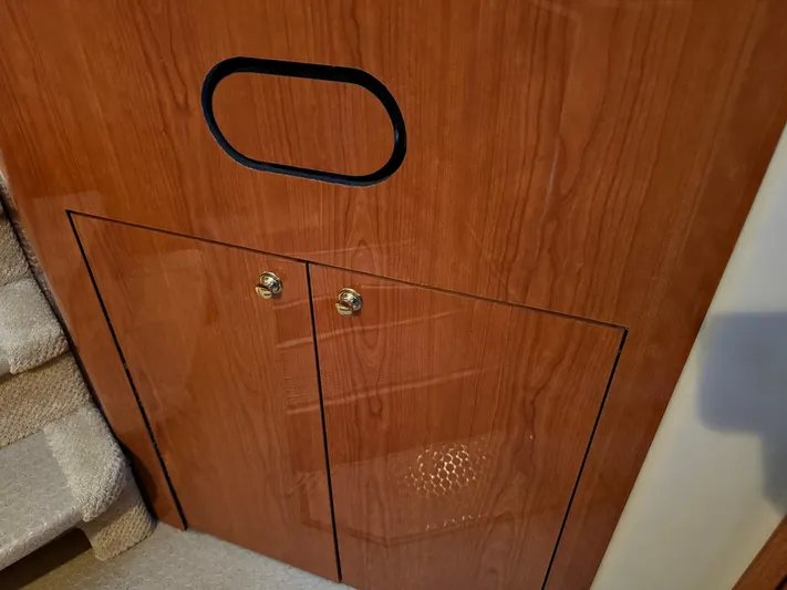 Fathom This Yacht Photos Pics Wooden cabinet with brass handles on a 2001 Sea Ray 420 Aft Cabin yacht.