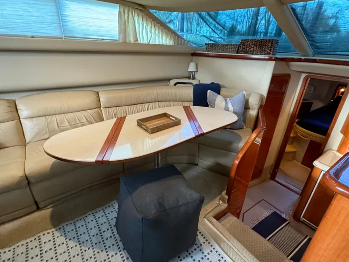 Fathom This Yacht Photos Pics Interior of 2001 Sea Ray 420 Aft Cabin with elegant seating and dining area.