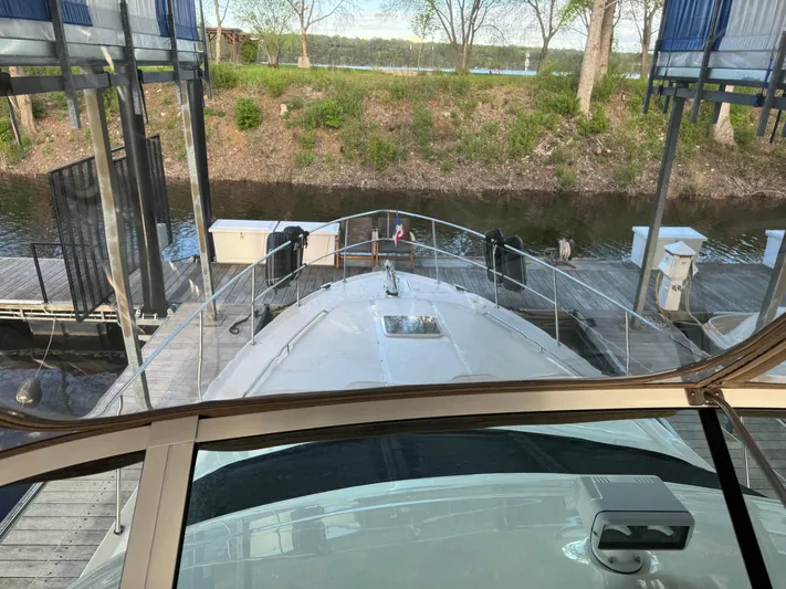 Fathom This Yacht Photos Pics 2001 Sea Ray 420 Aft Cabin yacht docked at marina, viewed from helm.